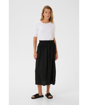 Dieser Damen-Midirock punktet mit elastischem Bund, lockerer A-Linie und vielseitiger Midi-Länge. Das leichte Material bietet hohen Tragekomfort für Alltag und Büro.  Schonwäsche 30°, Nicht bleichen, Nicht im Trockner trocknen, Tropnass aufhängen im Schatten, Kalt bügeln max. 110° C, Trockenreinigung  83% Viskose,17% Nylon