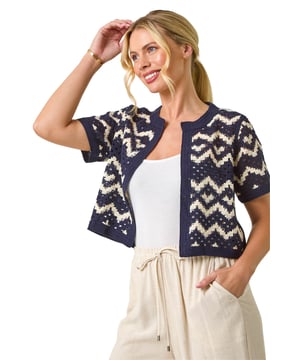 Petite Chevron Open Crochet Cardigan from Roman. This round neck open cardigan features a beautiful crochet design, adding a touch of texture and style. The pull on style makes it easy to wear, and it finishes at the hips for a flattering, relaxed fit. With short set-in sleeves, it’s perfect for layering during warmer months. Style it with a cami top and jeans for a chic, casual look that’s both comfortable and stylish!
