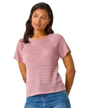 Crochet Knit Top from Roman. Give your wardrobe a new look with this stylish crochet knit top. Perfect for the Spring Summer season, this short sleeved top features a classic round neckline and is expertly crafted from a soft crochet knit fabric for effortless wear. Designed in a flattering tee shape, this top is versatile and easy to style. Pair it with jeggings and trainers for a casual outfit that exudes laid-back vibes!