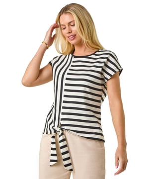 Petite Block Striped Tie Side Top from Roman. Effortlessly stylish, this chic tie side top is a must-have for the warmer months. Crafted from a comfortable stretch fabric, this top features a classic round neckline and finishes at the hips. Designed in a flattering pull-on style with charming tie details on the sides, this top is perfect for a casual yet trendy look. Complete with short sleeves, this top pairs beautifully with shorts and sandals for a laid-back summer ensemble.