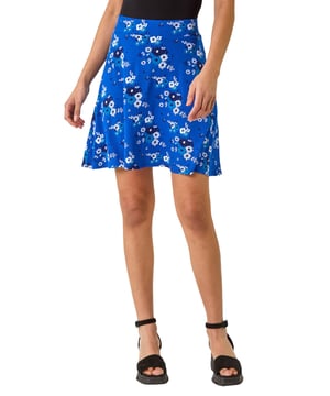 Floral Print Skater Stretch Skirt from Roman. Enhance your Spring/Summer wardrobe with this floral printed skater skirt. The pull-on style features a comfortable elasticated waistband for easy wear. Crafted from a soft jersey fabric, this skirt exudes a feminine charm and flirty silhouette. Pair it with a stylish cami top and sandals for a breezy look perfect for the warmer seasons!