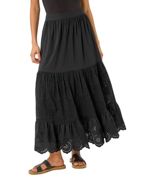Dusk Tiered Broderie Maxi Skirt from Roman. Embrace summer vibes with this delightful tiered broderie skirt. The intricate broderie design adds a charming touch to this maxi length skirt, perfect for sunny days. The tierred style adds flow and movement to your look, creating an effortlessly feminine silhouette. Pair it with a simple cami top and sandals for an easy-breezy summer outfit that will keep you cool and stylish all day long.