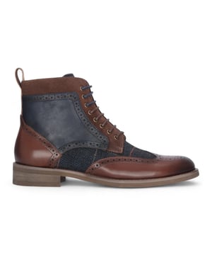 Refine your footwear collection with the Teddy Men's Brown Leather and Navy Tweed Oxford Shoes. Crafted from genuine leather with contrasting navy tweed panels, these shoes offer a perfect blend of traditional style and modern character. The Oxford silhouette provides a smart, structured shape, ideal for formal occasions or smart-casual outfits. A soft inner lining ensures comfort throughout the day, making them as wearable as they are stylish.

Premium Brown Leather Upper for a polished and durable finish

Contrasting Navy Tweed Panels add texture and a unique twist

Classic Oxford Design with a structured silhouette

Lace-Up Fastening ensures a secure and adjustable fit

Soft Inner Lining for comfort during extended wear

Stitched Detailing for added craftsmanship and style

Ideal for Smart-Casual to Formal Events — weddings, work, or evening outings