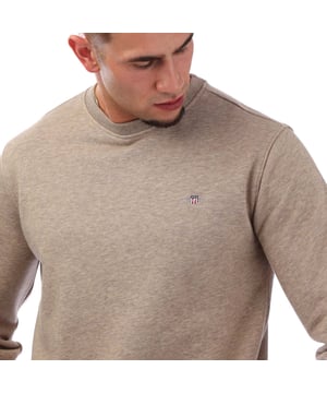 Crafted from a soft cotton blend  this GANT sweatshirt is designed for a regular fit. A simple yet modern design  it features ribbed detailing and GANT's iconic shield graphic embroidered at the chest. Style with the matching GANT sweatpants for a cozy  coordinated set. By choosing our cotton products  you’re supporting GANT's investment in Better Cotton’s mission. This product is sourced via a system of mass balance and therefore may not contain Better Cotton. Read more on bettercotton.org-massbalance