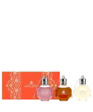 Indulge in the Molton Brown Festive Bath & Shower Gel Bauble Gift Set, featuring three luxurious 75ml shower gels: Fiery Pink Pepper, Re-charge Black Pepper, and Delicious Rhubarb & Rose. Each gel offers a unique aromatic experience: Fiery Pink Pepper invigorates with its spicy notes, while Re-charge Black Pepper energizes with a refreshing blend of citrus and spices. Delicious Rhubarb & Rose leaves your skin delicately scented with a harmonious mix of fruity and floral notes. Perfect for gifting, this cruelty-free set is sure to delight anyone seeking a premium shower experience.
