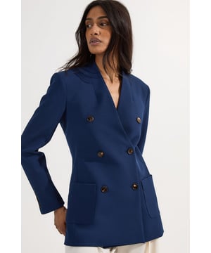 This Karen Millen Tailored Textured Double Breasted Jacket brings refined sophistication to your workwear collection. The textured woven fabric adds visual interest whilst maintaining a professional appearance, perfect for making an impression in the boardroom. Style with tailored white trousers as shown for a crisp, contemporary look, or pair with a pencil skirt and court shoes for traditional office elegance. The versatile regular fit ensures comfort throughout your busy day, whilst the structured silhouette creates a flattering shape that transitions seamlessly from day to evening. This jacket works brilliantly as part of a capsule wardrobe, complementing both formal ensembles and smart-casual combinations. For important presentations or client meetings, layer over a silk blouse and finish with understated jewellery for a look that conveys confidence and authority.  Sophisticated double-breasted design with distinctive textured fabric Elegant collared neckline for a refined silhouette Practical patch pockets add functionality to this tailored piece Structured shoulders create a polished, professional profile Versatile regular fit allows comfortable layering over various outfits  Matching piece sold separately.