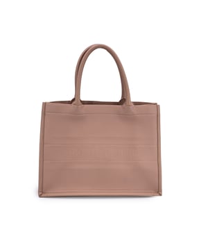 VINTAGE, RRP AS NEW
This beautiful Bag will come with a Certificate of ity provided by Entrupy. The certificate will be provided at no further cost  An icon of modern luxury, the Dior Book Tote brings together elegant design and everyday practicality in a way only the House of Dior can. With its structured, minimalist silhouette and signature double rolled handles, this tote is more than just a bag-it's a statement of refined taste and effortless style.  This particular piece is crafted in dusty pink embossed leather, a soft yet striking hue that beautifully showcases the signature Christian Dior Paris proudly stitched across the front. The open-top design reveals a tonal suede interior-spacious and unlined, ready to carry your daily essentials with grace and ease.  Beloved by fashion editors, influencers, and celebrities alike, the Book Tote has quickly become a contemporary classic. Made in Italy with the kind of craftsmanship that speaks for itself, it's a piece that promises to elevate every outfit-whether carried to brunch or the boardroom.  Condition Rating: B - VERY GOOD CONDITIONCondition Details: Gently used. The leather exterior is in excellent shape, with minor creases likely caused by storage. Some wear of use on bottom corners. Please check the photos carefully and ask if you need to know more details or if you have any doubts.Measurements (cm):Depth: 16.5Height: 27.9Length: 35.6Other Details: Dustbag? NoKeys? NoBox? No Measurments:  width: 165 mm length: 356 mm height: 279 mm
