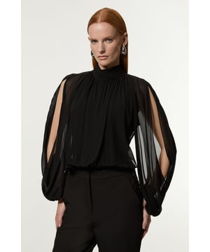 Prepare for admirable glances with this standout petite bodysuit. With a figure-hugging bodycon fit, lace detailing, and flowing sleeves, this bodysuit is set to elevate any outfit. Style with anything, from tailored trousers to a leather skirt for infinite styling options. Petite Viscose Georgette Cady Lace Insert Bodysuit Striking Open Sleeves Lace Detailing in Back Long Sleeves Statement Backless Design Flattering High Neckline Bodycon Silhouette Button and Zip Fastenings in Back Expertly designed for those 5'3" and under, our Petite pieces are perfectly proportioned for a smaller frame using shorter lengths.Discover our collection of occasion wear or browse our range of women's occasion dresses now.