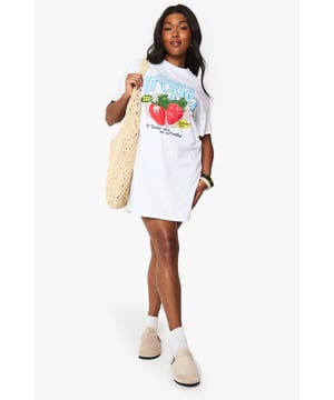 Oversized T-shirt dress featuring a vibrant Saint Tropez strawberry graphic print
        Relaxed crew neckline and short sleeves for effortless comfort
        Cotton fabric offers breathable wear perfect for warmer days
        Versatile mini length ideal for casual styling
        Plus size design with a roomy, comfortable fit
    
    This playful Saint Tropez graphic T-shirt dress from Boohoo brings carefree holiday vibes to your everyday wardrobe. The oversized silhouette creates a relaxed look that's both comfortable and on-trend. Style it as seen with ankle boots and a woven tote for farmers' markets and weekend brunches, or pair with trainers and a denim jacket for casual coffee dates. For festival season, add chunky jewellery and wellies for an effortlessly cool ensemble. The versatile design works brilliantly with leggings underneath during transitional weather, while the cotton composition ensures all-day comfort. This T-shirt dress embodies the laid-back aesthetic that's perfect for casual gatherings and daytime outings when you want to combine comfort with personality.