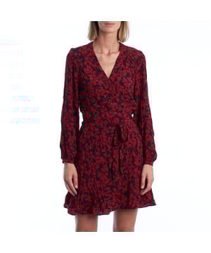 This short Zadig & Voltaire dress stands out with its enveloping floral print and a wrap silhouette that naturally flatters the figure. The V-neckline adds femininity, while the long sleeves with elastic cuffs balance the design, perfect for transitional or casual evening looks.\\n\\n The matching belt cinches the garment at the waist, defining the body with a wraparound effect. The ruffled hem adds a subtle touch of movement, elevating the look without sacrificing its freshness.\\n\\n Details:\\n - Cut: Crossover, short.\\n - Neckline: V-neck.\\n - Sleeve: Long with elastic cuff.\\n - Waist: Thin belt of the same fabric.\\n - Low: With fluid steering wheel.\\n - Closure: Crossover with side bow.\\n\\n A versatile dress with character, designed for women seeking effortless style. Ideal for dinners, dates, or any special occasion with a bohemian and modern touch.\\n Composition: 100% Viscose\\n Care:\\nMachine wash on a delicate cycle. Do not bleach. Do not tumble dry. Iron at low temperature if needed.
