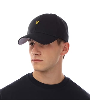 Mens Lyle And Scott Heavy Twill Baseball Cap in navy.- Six-panel construction.- Adjustable strap.- Curved peak finish.- Embroidered eagle logo on front.- Eyelet detailing.- Shell: 100% Cotton.- Ref: HE2100AZ271