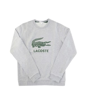 Boys’ Crew Neck Vintage Logo Fleece Sweatshirt Unbrushed cotton blend fleece Ribbed crew neck Tone-on-tone ribbed finishes at sleeve ends and bottom of garment Print Lacoste lettering and crocodile on chest Embroidered green crocodile on back