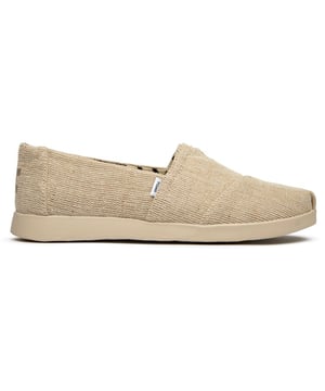 Effortlessly chic and wonderfully comfortable, these canvas espadrilles bring laid-back sophistication to any wardrobe. The natural tone pairs beautifully with everything from flowing sundresses to cropped denim, while the durable rubber sole provides reliable traction for all your adventures. Classic TOMS styling meets enhanced comfort in this elevated take on the beloved Alpargata silhouette.