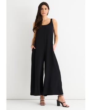 Indulge in effortless elegance with our Black Air Flow Strappy Wide leg Jumpsuit. Crafted with a flattering wide leg design and intricate strappy detailing, this jumpsuit is the perfect combination of sophistication and comfort. Made with airy fabric for maximum breathability, it's the ultimate piece for a stylish and comfortable look.