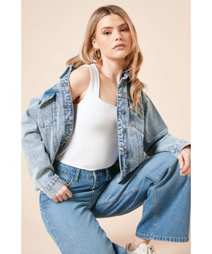 Oversized fit for a relaxed, contemporary silhouette
        Classic collared neckline with button-through front closure
        Practical chest pockets for added functionality
        Structured seam detailing for a flattering shape
        Versatile design that works across seasons
    
    This Dorothy Perkins oversized denim jacket offers the perfect blend of comfort and style for your casual wardrobe. The relaxed fit provides ample room for layering over your favourite tops and dresses, while the timeless design ensures it remains a staple piece season after season. Style with wide-leg jeans and a simple white tee for an effortlessly cool double denim look, or throw over a floral midi dress for weekend brunches with friends. The versatile nature of this jacket makes it ideal for family gatherings, coffee dates, and casual outings. Pair with trainers for day-to-day wear or dress up slightly with ankle boots for evening drinks. Machine washable and crafted from cotton, this jacket combines practicality with enduring style - a true wardrobe essential that will serve you well for years to come.