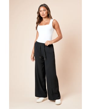Elegant wide leg silhouette for a flattering, on-trend look
        Adjustable tie waist detail for a customised fit
        Practical side pockets for everyday convenience
        Flowing woven fabric that moves beautifully with you
        Versatile design that pairs effortlessly with casual and smart casual pieces
    
    These Dorothy Perkins tie waist wide leg trousers offer the perfect balance of comfort and style for your everyday wardrobe. The relaxed wide leg cut creates a fashionable silhouette while the adjustable tie waist ensures a comfortable, flattering fit that works for various body types. Style them as seen with a simple fitted top to balance the voluminous bottom half, and add white trainers for a contemporary daytime look. These trousers are ideal for weekend brunches with friends, family gatherings, or casual office days. The woven fabric drapes beautifully while maintaining structure, and the inclusion of practical pockets adds functionality to this stylish piece. For cooler days, layer with an oversized cardigan or denim jacket to complete your effortlessly chic ensemble.