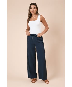 Elegant wide leg silhouette for a flattering, on-trend look
        Adjustable tie waist detail for a customised fit
        Practical side pockets for everyday convenience
        Flowing woven fabric that moves beautifully with you
        Versatile design that pairs effortlessly with casual and smart casual pieces
    
    These Dorothy Perkins tie waist wide leg trousers offer the perfect balance of comfort and style for your everyday wardrobe. The relaxed wide leg cut creates a fashionable silhouette while the adjustable tie waist ensures a comfortable, flattering fit that works for various body types. Style them as seen with a simple fitted top to balance the voluminous bottom half, and add white trainers for a contemporary daytime look. These trousers are ideal for weekend brunches with friends, family gatherings, or casual office days. The woven fabric drapes beautifully while maintaining structure, and the inclusion of practical pockets adds functionality to this stylish piece. For cooler days, layer with an oversized cardigan or denim jacket to complete your effortlessly chic ensemble.