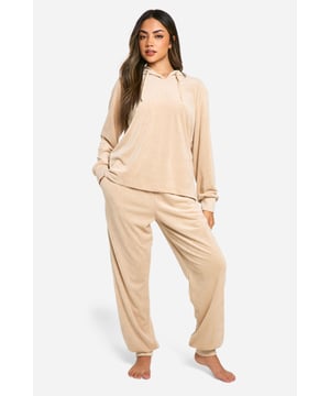 Cosy ribbed fleece fabric for ultimate comfort
        Relaxed-fit hoodie with spacious hood
        Matching joggers with tapered leg design
        Versatile two-piece set for lounging or casual wear
        Soft, breathable material ideal for year-round use
    
    Embrace laid-back luxury with this ribbed fleece hoodie and jogger set from Boohoo. Perfect for those nights in or lazy weekends, this coordinated ensemble offers both style and comfort. The hoodie features a roomy hood and a relaxed fit, ideal for layering over your favourite tee or vest. Pair it with the matching joggers, which boast a flattering tapered leg, for a put-together look even when you're off-duty. The soft, breathable fabric ensures you stay comfortable whether you're catching up on sleep or binge-watching your latest TV obsession. For a quick dash to the shops, simply throw on some trainers and you're good to go. This versatile set is a must-have addition to your loungewear collection, offering endless styling possibilities for the fashion-forward woman who values both trend and comfort.