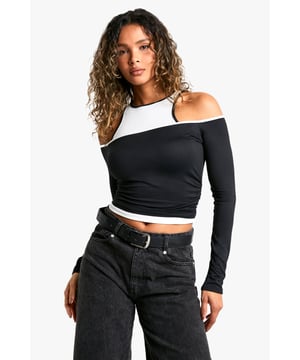 Two-layered design for added interest and versatility
        Asymmetrical neckline with contrasting colours
        Long sleeves for cooler weather options
        Cropped length to accentuate the waistline
        Figure-hugging fit for a sleek silhouette
    
    Make a bold statement with this eye-catching two-layered top from Boohoo. The asymmetrical neckline and contrasting colour detail create a striking visual effect, perfect for those who love to stand out from the crowd. The long sleeves and cropped length offer versatility, allowing you to transition effortlessly from day to night. Style it with high-waisted wide-leg trousers and trainers for a casual daytime look, or pair it with a leather mini skirt and ankle boots for a night out with friends. The figure-hugging fit flatters your curves, while the unique design adds a touch of edginess to your wardrobe. Whether you're heading to a family gathering or a casual coffee date, this top is sure to turn heads and keep you looking fashion-forward.