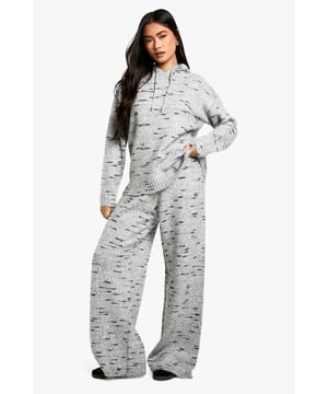 Wide-leg knit trousers for ultimate comfort
        Textured fabric with a unique speckled pattern
        High-waisted design for a flattering silhouette
        Relaxed fit through the legs for easy movement
        Versatile style suitable for various casual occasions
    
    Embrace laid-back chic with these wide-leg knit trousers from Boohoo. The textured fabric features an eye-catching speckled pattern, adding visual interest to your casual ensemble. The high-waisted design creates a sleek silhouette, while the relaxed fit through the legs ensures all-day comfort. Perfect for lazy weekends or casual outings, these trousers can be effortlessly styled with a cropped hoodie and trainers for a trendy look. For a more put-together appearance, pair them with a fitted turtleneck and ankle boots. The versatility of these trousers makes them a must-have addition to your wardrobe, suitable for family gatherings, coffee dates with friends, or simply lounging at home in style. Customise your look by rolling up the hems or leaving them long to create different vibes for various occasions.