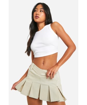Tennis-inspired skort design for a sporty-chic look
        Pleated skirt overlay for a flirty and feminine touch
        High-waisted fit to accentuate the waistline
        Bengaline fabric offers a smooth and stretchy feel
        Versatile piece suitable for both athletic and casual wear
    
    Embrace the athleisure trend with this stylish tennis-inspired skort from Boohoo. Perfect for the fashion-forward woman who values both comfort and style, this piece effortlessly bridges the gap between sporty and chic. The high-waisted design flatters your figure, while the pleated skirt overlay adds a playful, feminine flair. Pair it with a cropped tank top and trainers for a casual daytime look, or dress it up with a fitted blouse and ankle boots for a night out with friends. The versatile nature of this skort makes it an ideal choice for various occasions, from casual outings to family gatherings. Its blend of athletic inspiration and trendy design ensures you'll stand out in the best way possible, embodying the Boohoo spirit of fun, inclusive fashion that keeps you at the forefront of style.