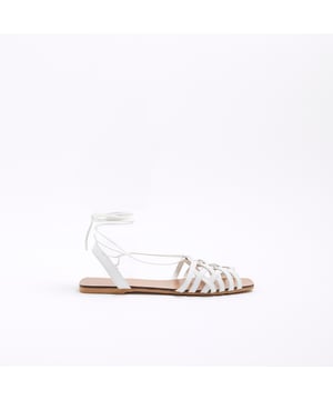 Caged design, Open toe, Tie up fastening, Flat sole, Wide fitAbout the brandFASHION IS OUR DNARiver Island is an icon of the British high street. Inspired by the latest trends and our heritage style archives, we've been serving style and leading trends for over sixty years.We make fashion for real people with real lives, who want to look real good. Because life's a celebration - let's dress for it.