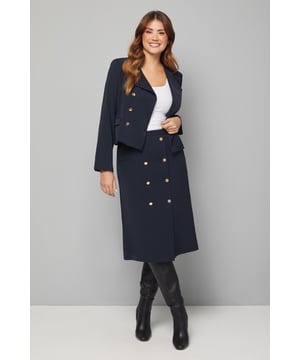 Elegant midi column skirt with sophisticated wrap design
        Decorative double-breasted gold-tone button detailing adds a luxurious touch
        Flattering column silhouette that creates a streamlined look
        Smooth woven fabric offers comfortable all-day wear
        Fully lined for optimal comfort and structure
    
    Make a sophisticated statement with this Wallis midi column skirt, designed with a distinctive wrap front and decorative button detailing. The sleek silhouette offers a flattering fit that works beautifully for smart occasions whilst maintaining comfort throughout the day. Style with a crisp white top and knee-high boots for a polished office ensemble, or pair with a silk blouse and court shoes for evening events. The versatile design transitions seamlessly from boardroom to dinner, making it an essential addition to your smart wardrobe. For cooler weather, layer with a coordinating blazer to create a chic suit effect that exudes confidence and refinement. This timeless piece will quickly become a go-to for occasions where you want to convey elegance with minimal effort.