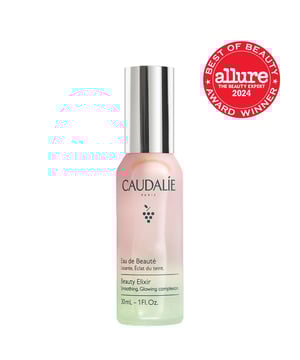 Experience the rejuvenating effects of Caudalie's Beauty Elixir, a versatile face mist that preps and refreshes your skin with just a few spritzes. This iconic product doubles as a makeup setting spray and features a gentle formula made from 100% natural ingredients, including green grape, orange blossom, and essential oils like peppermint and rose. Perfect for all skin types, it's a must-have in your skincare routine. Use it anytime for an instant hydration boost and radiant complexion. Caudalie donates 1% of its turnover to environmental causes, making it a responsible choice.
