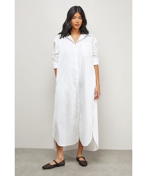 Oversized fit with dramatic side splits for effortless movement
        Midi length design with classic collar and full button-through front
        Long sleeves with buttoned cuffs for versatile styling options
        Relaxed dropped shoulders creating a contemporary silhouette
        Chest pocket detail adding subtle functional interest
    
    Make a statement with this Warehouse oversized midi shirt dress, the epitome of casual sophistication. The generous proportions and side splits create a flowing silhouette that moves beautifully with you, whilst the classic shirt detailing keeps the look grounded in timeless style. Perfect for family gatherings when paired with metallic flats as shown, or dress it down further with white trainers and a crossbody bag for weekend brunches. For cooler days, layer over slim-fit trousers and add a chunky knit cardigan. The cotton-rich fabric offers comfort for all-day wear, making this an ideal choice for those busy days when you need to look put-together with minimal effort. This versatile piece transitions effortlessly from casual daytime events to relaxed evening occasions - simply switch your accessories to refresh your look.
