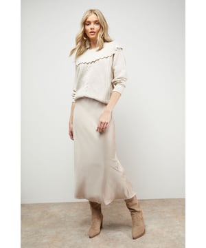 Elegant bias cut design creates a flattering drape that skims the silhouette
        Lustrous satin fabric catches the light beautifully with every movement
        Midi length hits below the knee for a contemporary, versatile profile
        Subtle side slit adds a touch of feminine flair and ease of movement
        Smooth waistband sits comfortably at the natural waist
    
    This Oasis bias cut satin midi skirt showcases the perfect balance of casual sophistication and everyday wearability. The diagonal cutting technique creates a gorgeous drape that flows with your body rather than against it, whilst the glossy satin fabric adds a touch of luxury to your daytime wardrobe. Style with a simple vest top and flat loafers as seen on our model for an effortlessly chic weekend look, or pair with a soft knit jumper and trainers for coffee dates and family gatherings. The versatile midi length works beautifully for various casual occasions, from shopping trips to informal lunches. Complete your ensemble with a woven handbag and delicate jewellery for a feminine finishing touch that reflects the pretty, girly aesthetic Oasis is known for.