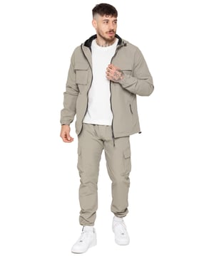 Gear up with the Enzo Milano Men’s Lightweight Cargo Jacket & Pants Set, built for comfort, function, and style. The jacket features water-repellent crushed poly fabric with a breathable mesh lining, full zip front, adjustable hood, and multiple secure pockets. Paired with lightweight cargo pants in a regular fit, this set includes an elasticated waistband with drawstring, cargo pockets, and adjustable hems for a personalized fit.
