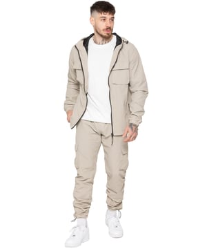 Gear up with the Enzo Milano Men’s Lightweight Cargo Jacket & Pants Set, built for comfort, function, and style. The jacket features water-repellent crushed poly fabric with a breathable mesh lining, full zip front, adjustable hood, and multiple secure pockets. Paired with lightweight cargo pants in a regular fit, this set includes an elasticated waistband with drawstring, cargo pockets, and adjustable hems for a personalized fit.