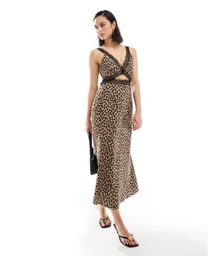Dresses by Never Fully Dressed For your weekend mood board Deep V-neck Adjustable straps Lace inserts Cut-out panel Regular fitSold By: Asos