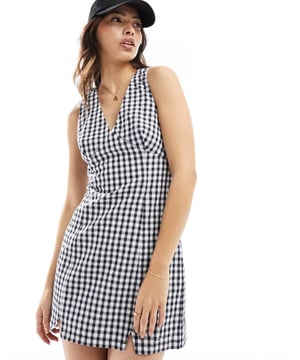 Dresses by Tommy Jeans Check you out V-neck Cross-back straps Slim fitSold By: Asos