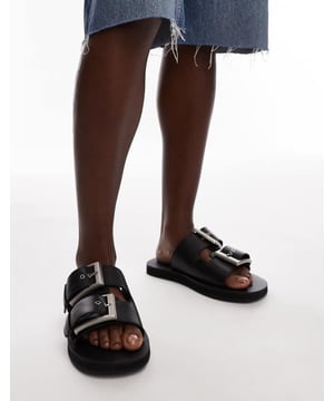 Shoes by Topshop This is Topshop Adjustable strap Slip-on style Chunky buckles Open toe Flat soleSold By: Asos