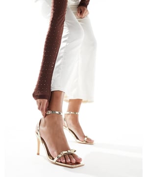 Shoes by Glamorous Give your feet some airtime Adjustable strap Pin-buckle fastening Bow detail Open toe Stiletto heelSold By: Asos