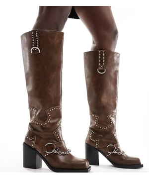 Shoes by Public Desire Wide Fit Talk about yeehaw Pull-on style Stud embellishments Chain detail Square toe High block heel Wide fitSold By: Asos