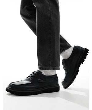 Shoes, Boots & Trainers by Calvin Klein Jeans Good things come in pairs Lace-up fastening Signature Calvin Klein branding Round toe Chunky sole Lugged treadSold By: Asos