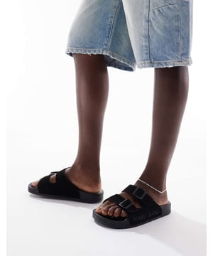 Shoes by Karl Kani Poolside vibes Branded design Slip-on style Buckle straps Open toe Moulded footbed Flat soleSold By: Asos