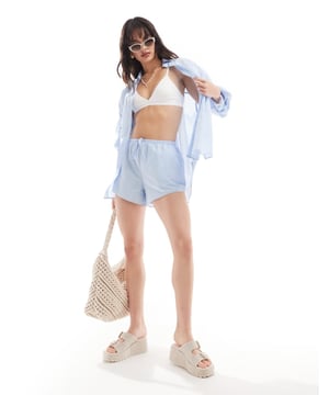 Shorts by SNDYS Part of a co-ord set Shirt sold separately Plain design Regular rise Elasticated drawstring waist Pockets to side Regular fitSold By: Asos