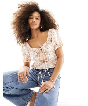 Tops by ASOS DESIGN Introduce it to your other nice tops Sweetheart neck Puff sleeves Button placket Tie front Regular fitSold By: Asos