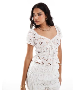Tops by ASOS DESIGN Part of a co-ord set Shorts sold separately V-neck Cap sleeves Elasticated trims Tie front Ruched design Cropped length Regular fitSold By: Asos