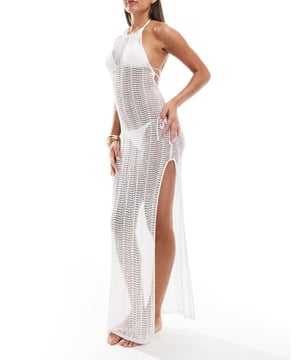 Swimwear & Beachwear by ASOS DESIGN From beach to bar Sheer finish Halterneck style Open weave Tie-back fastening Side splits Regular fitSold By: Asos