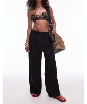 Trousers & Leggings by Topshop This is Topshop Crinkle finish High rise Drawstring waistband Relaxed fitSold By: Asos