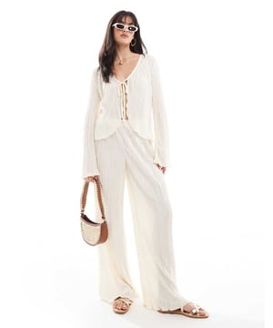 Trousers & Leggings by Pieces Part of a co-ord set Top sold separately Plain design Mid rise Elasticated waistband Wide legSold By: Asos