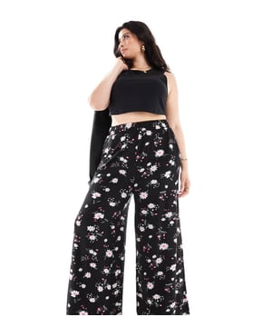 Trousers & Leggings by Yours Make your jeans jealous Floral print High rise Elasticated waistband Pockets to side Wide legSold By: Asos
