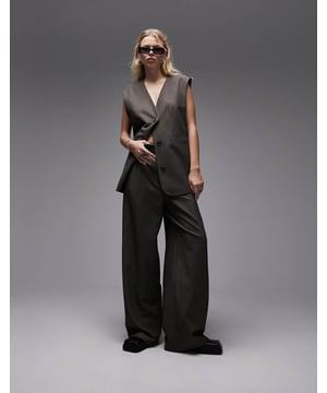 Joggers by Topshop Welcome to the next phase of Topshop Waistcoat sold separately High rise Belt loops Functional pockets Wide legSold By: Asos