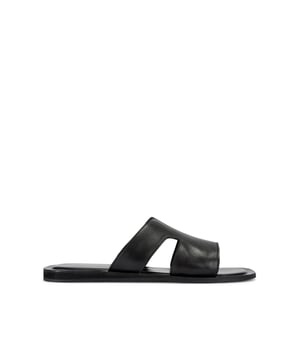 This KG Kurt Geiger Venice is a slip-on sandals crafted from a black textured leather. The footbed is lightly padded.
