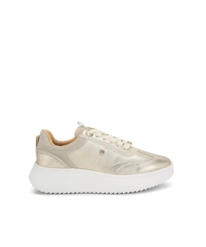 This KG Kurt Geiger Lemon Sneaker is crafted from a metallic gold leather alternative. There are gold tone branding details across the upper and the sole is in a chunky style.