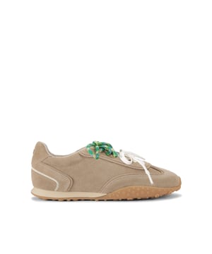 The Lagos is a beige suede sneaker. The front is laced up with both white and green tubular laces. The sole features a gum detail.